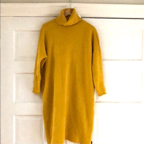 Long sweater with high neckline and back detail